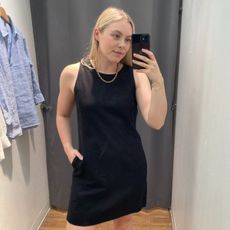 Woman wears black linen blend mini dress
