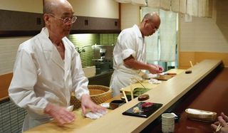 Jiro Dreams of Sushi Jiro cleans his work station mid-conversation