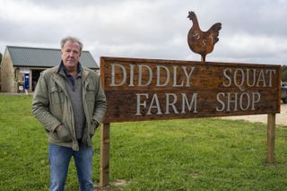 Jeremy Clarkson next to the 'Clarkson's Farm' shop.