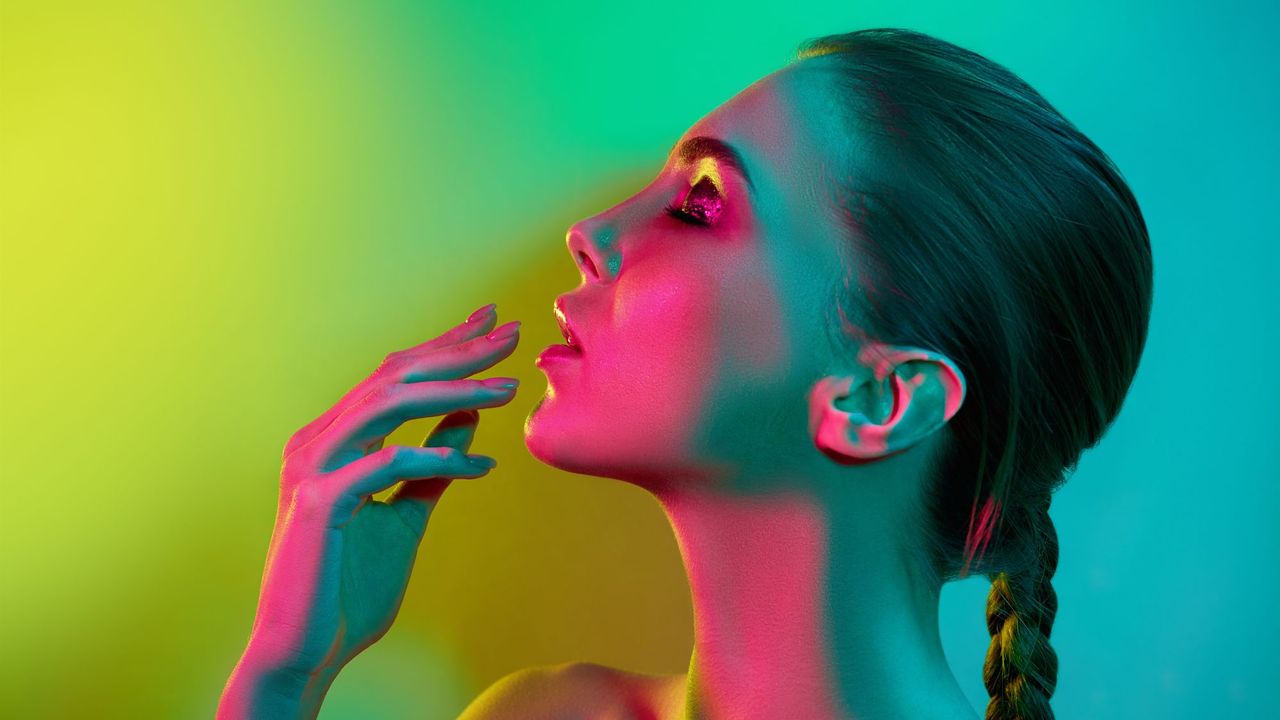  colour correcting palettes - Model with colourful lights lighting her up - gettyimages926617828