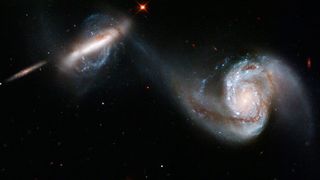 An image of two colliding galaxies as seen by the Hubble Space Telescope.