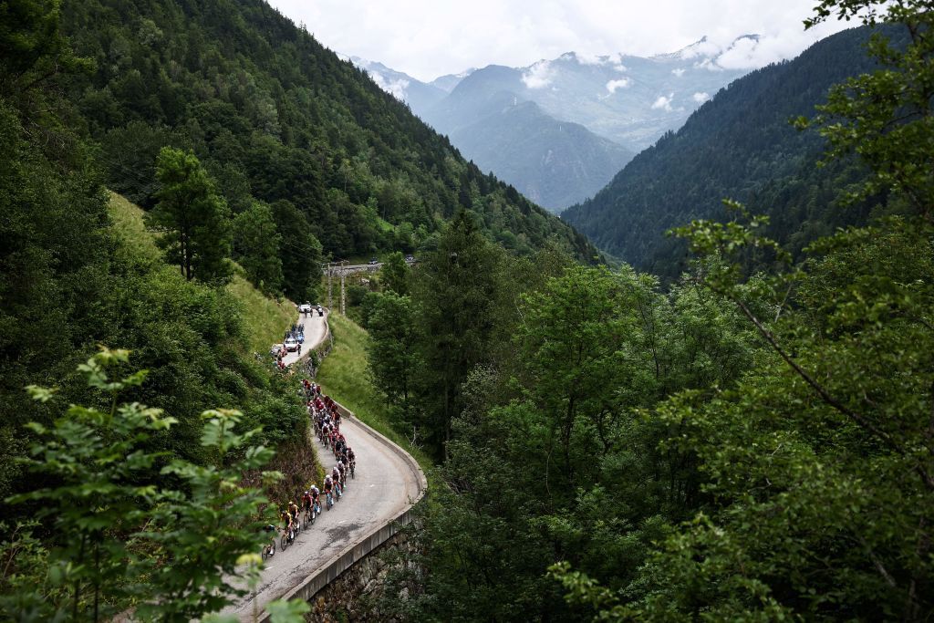 The pack rides during the seventh stage of the 75th edition of the Criterium du Dauphine cycling race 148km between Port de Savoie to Col de la Croix de Fer Saint Sorlin France on June 10 2023 Photo by AnneChristine POUJOULAT AFP Photo by ANNECHRISTINE POUJOULATAFP via Getty Images