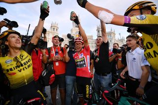 Gesink (right) celebrates teammate Primoz Roglic's Vuelta victory in Madrid