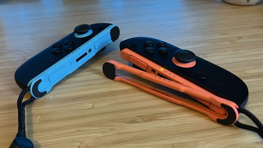 Nintendo Switch 2 Joy-Con controllers with additional skate accessory on a wooden desk