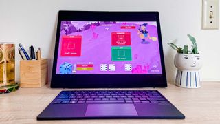Asus Zenbook 17 Fold OLED review unfolded on desk playing Dicey Dungeons