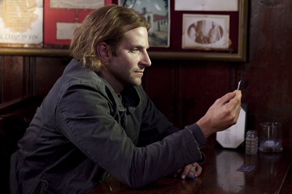 Character Eddie Mora (played by Bradley Cooper) contemplates taking the memory-boosing drug NZT in the movie &quot;Limitless.&quot;