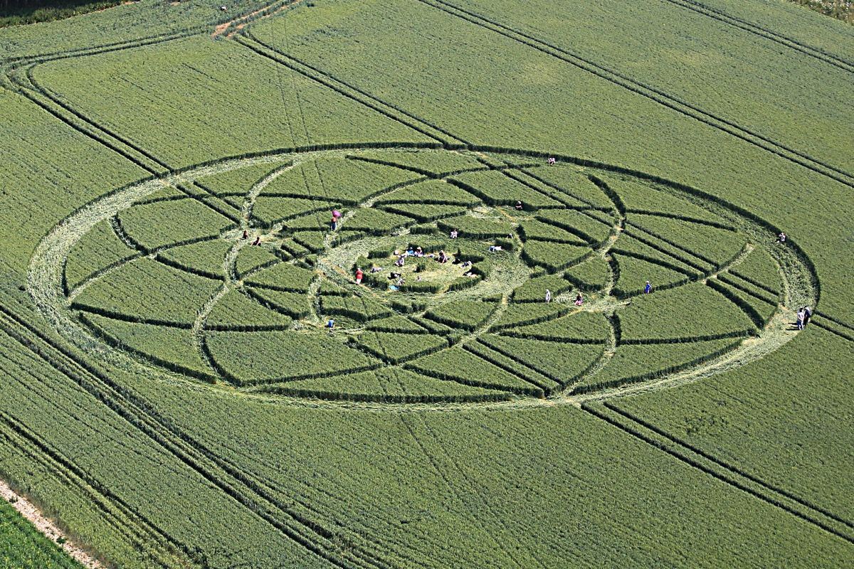 Sunbathers flock to a crop circle in a farmer&#039;s field on July 15, 2013, in Wiltshire, England. The crop circle measures about 500 feet (150 meters) across and lies east of Hackpen Hill, a spot known for its crop circles.