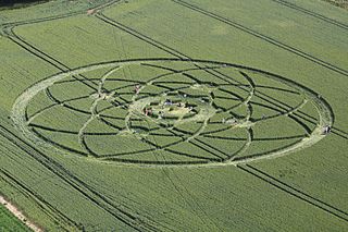 Sunbathers flock to a crop circle in a farmer's field on July 15, 2013, in Wiltshire, England. The crop circle measures about 500 feet (150 meters) across and lies east of Hackpen Hill, a spot known for its crop circles.