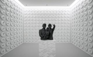 White room with sculpture in the middle