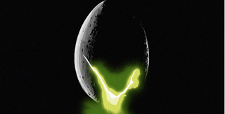 A large alien egg with green light seeping from its cracks