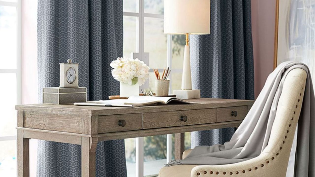 A writing desk in blond wood in a home office