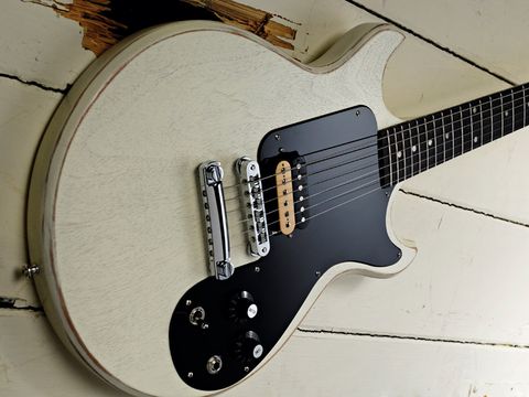 The worn white finish helps add to the guitar's vintage vibe