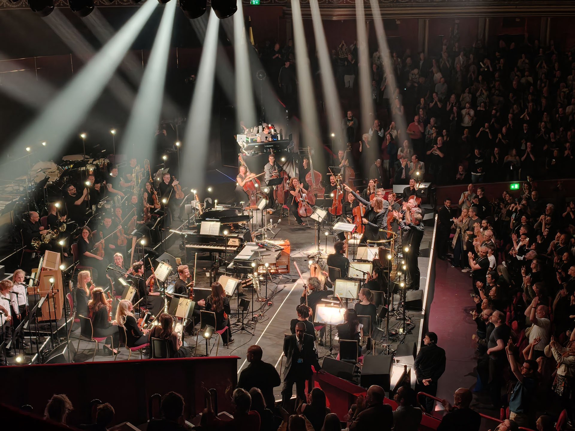 A photo of Sigur Ros playing with orchestra.