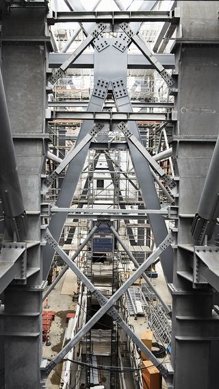 Inside view of the the Amager Bakke in Copenhagen while under construction. Large steel structures and scaffolding.