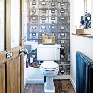 bathroom with door and wooden flooring