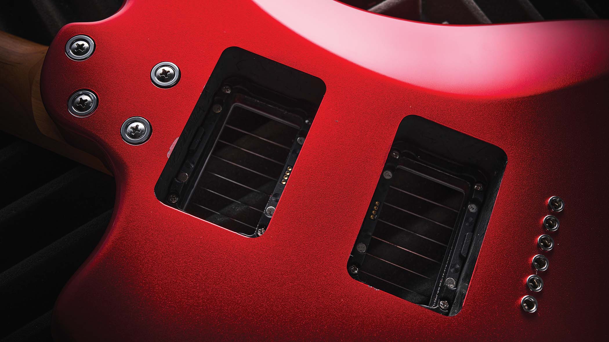 The red hardtail pickup-swapping offset is made in China, and comes with three Seymour Duncan and Guitar-X pickups included