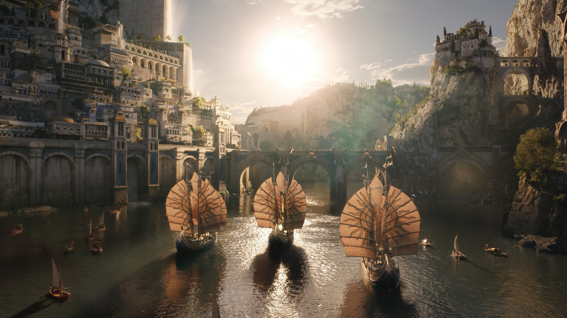 Tres barcos númenóreanos navegan hacia el reino insular bañado por el sol de Númenor en The Rings of Power