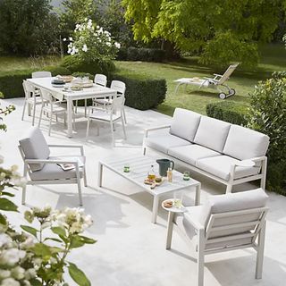 Santorin Metal 5 seater Coffee set on a garden patio next to a matching dining table