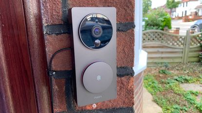 Aqara Video Doorbell G4 mounted on wall beside door