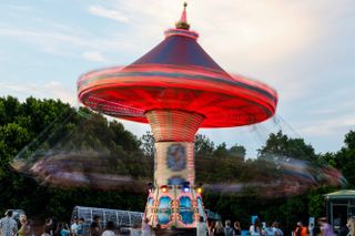 Image of swing chair ride lit up at fair grounds