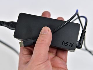 The tiny Type-C 65W charger is perfect to toss into a bag, not that you need it.