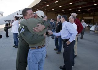 Pete Seibold and Mike Melvill celebrate a successful first glide test of SpaceShipTwo on Oct. 10, 2010.