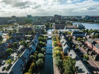 Overhead shot of a town next to a river