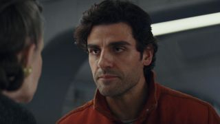 Oscar Isaac addresses Carrie Fisher on a starship bridge in Star Wars: The Last Jedi.