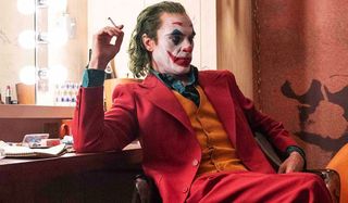 Joker Joaquin Phoenix scowls in the dressing room, while he smokes