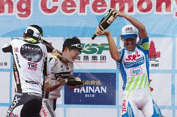 Cop that: Colli, Jae Jang and Van Hummel get into the spirit of a podium champagne fight in Dangfong.