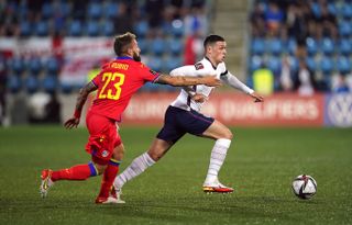 Phil Foden evades an opponent