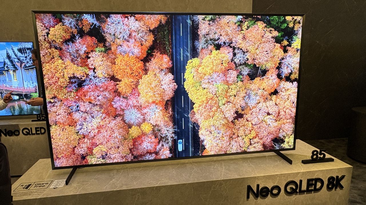 Samsung Q900F TV on a white stand at Samsung's CES 2025 showcase