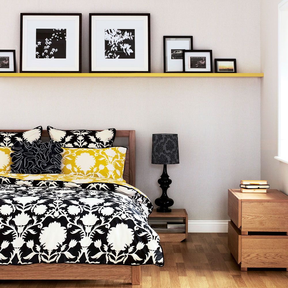 bedroom with shelf and picture frame and wooden floor