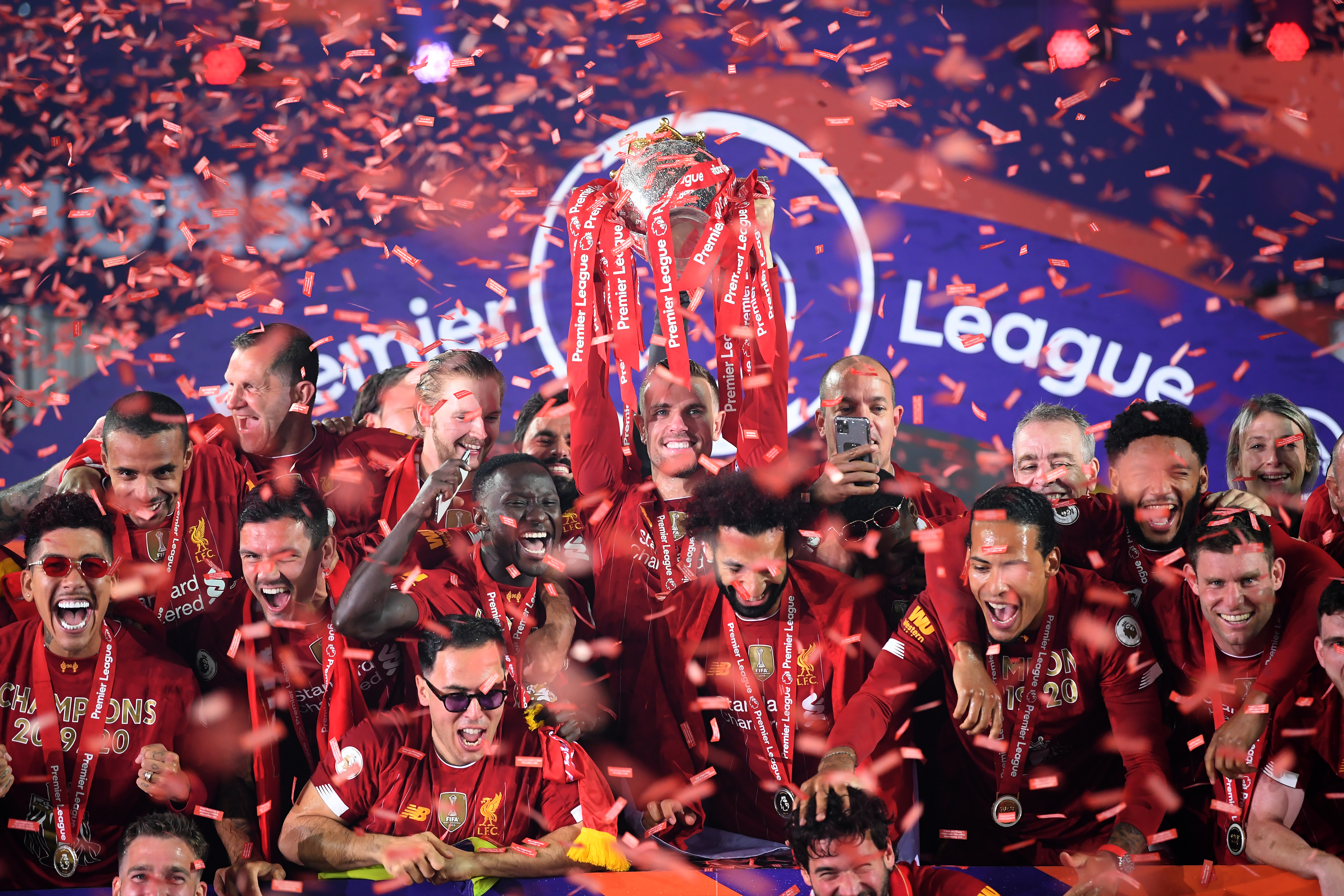 Jordan Henderson lifts the Premier League trophy for Liverpool in 2020