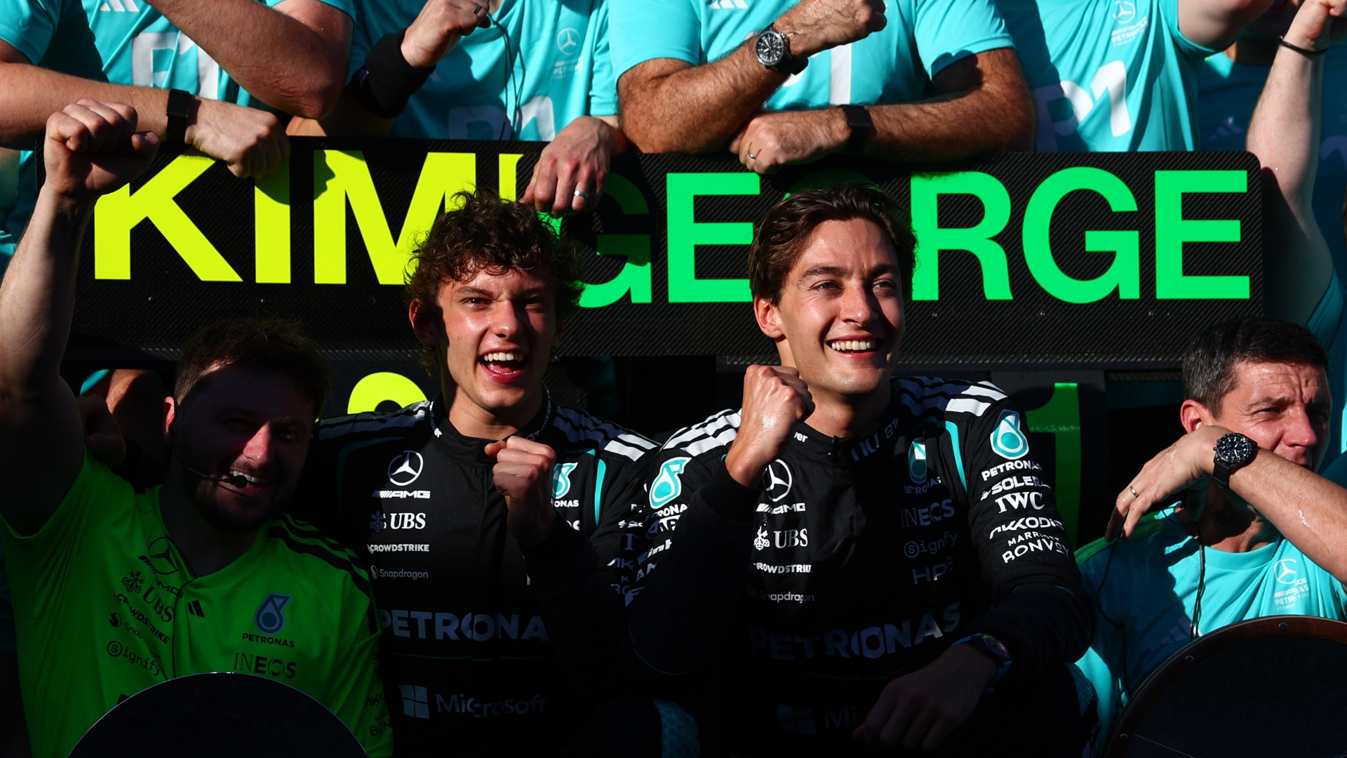 George Russell and Kimi Antonelli celebrating with the Mercedes team