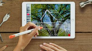 Logitech Crayon being used to design a tree house on a tablet