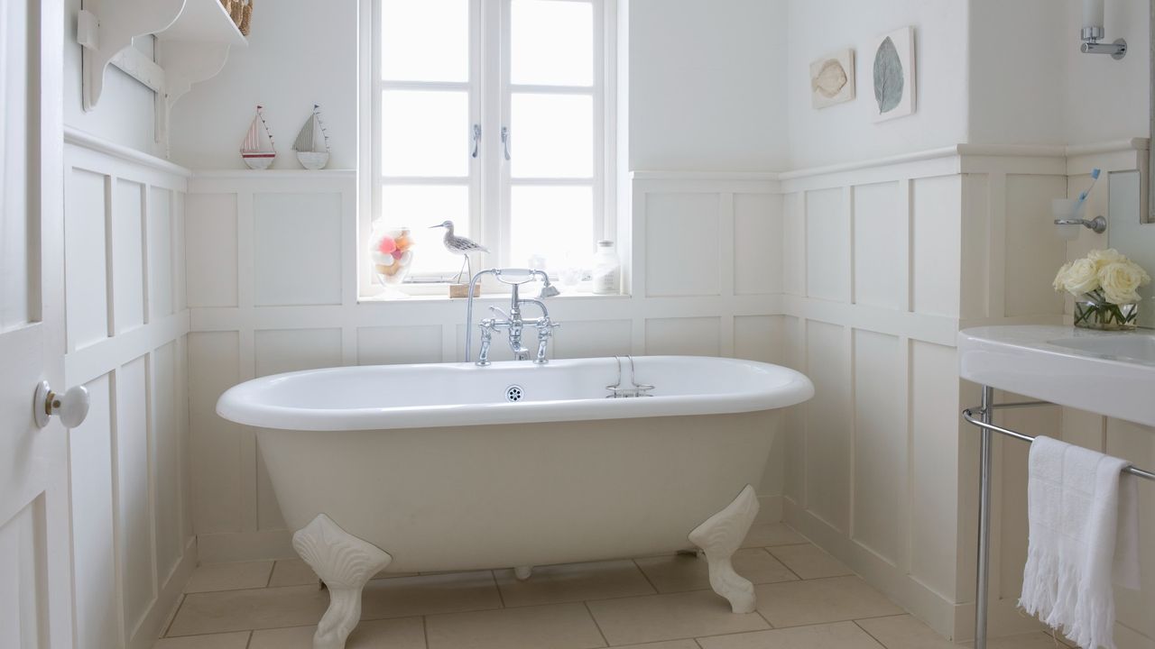 White bathroom with freestanding roll top bath 