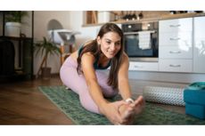 Woman stretching in a domestic setting
