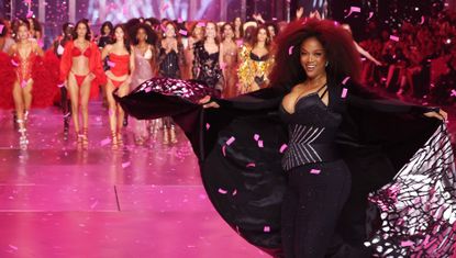 Tyra Banks at the Victoria&#039;s Secret Fashion Show 2024 wearing a bustier and leggings