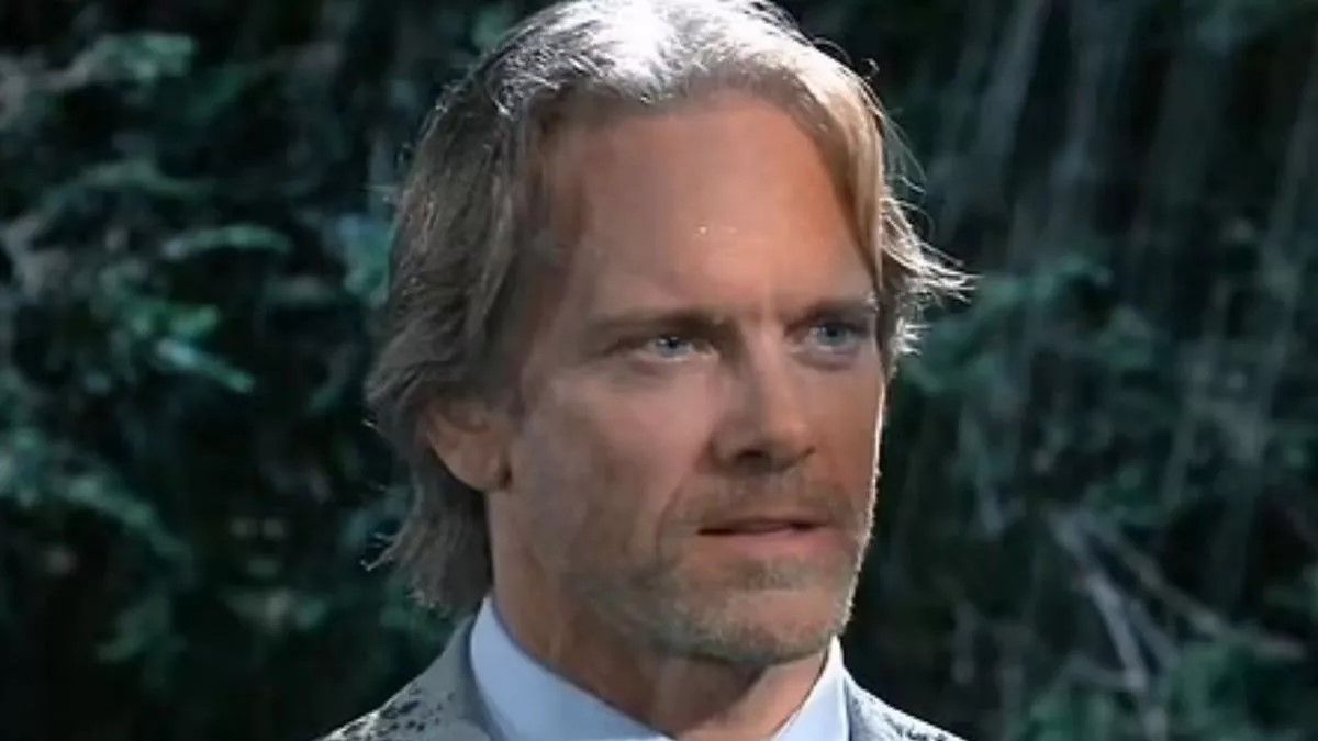 Adam J. Harrington as John Cates in the rain in General Hospital