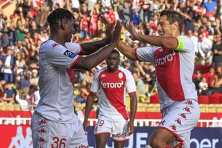Monaco's French forward Wissam Ben Yedder (R) celebrates after scoring a gaol with Monaco's Swiss forward Breel Embolo (L) during the French L1 football match between AS Monaco and FC Nantes at the Louis II Stadium (Stade Louis II) in the Principality of Monaco on October 2, 2022.