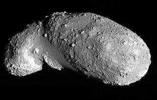 Image of the near-Earth asteroid Itokawa. The boulder-free areas appear relatively smooth and are filled with small, uniformly sized particles.