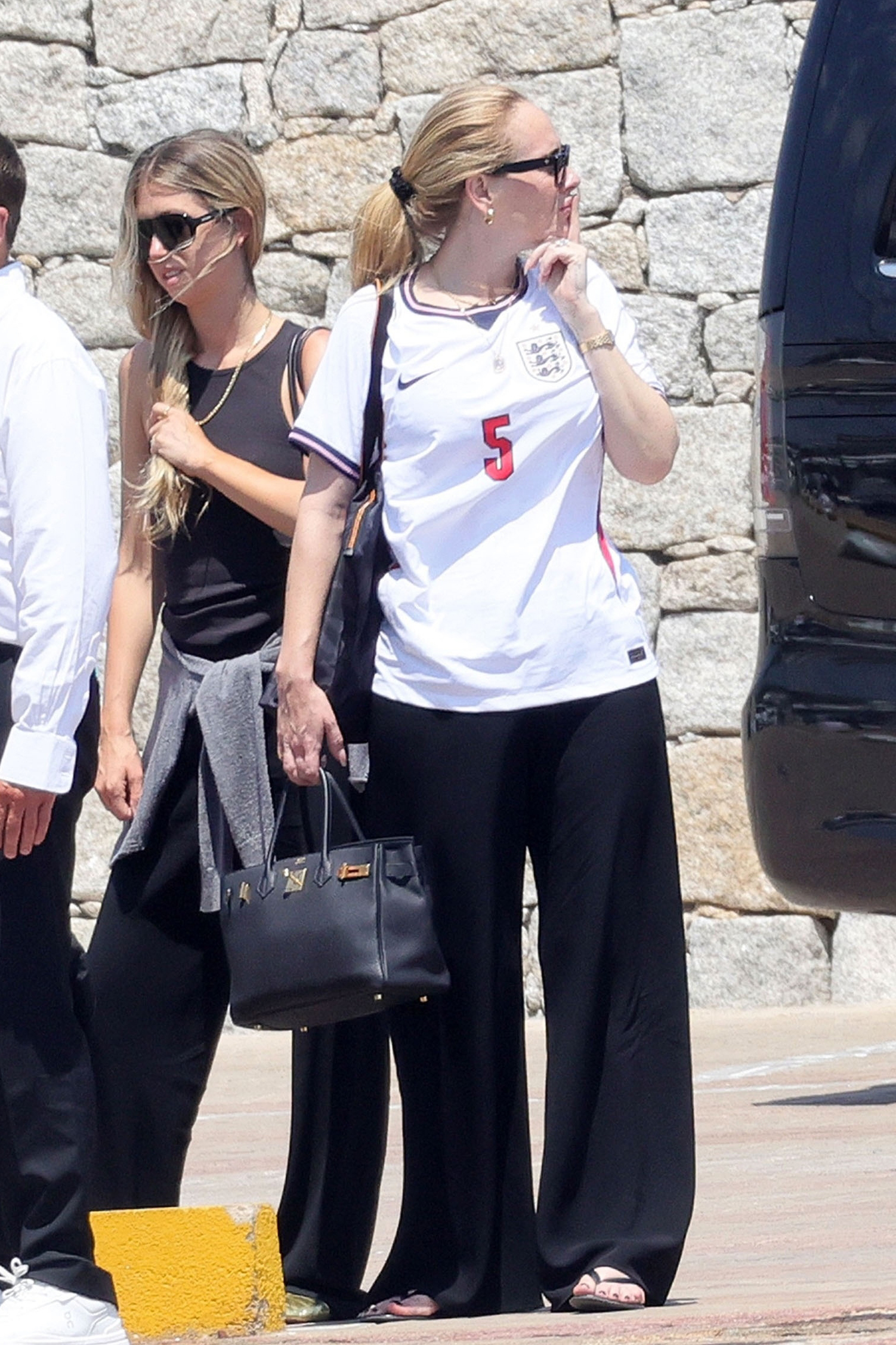 Adele was spotted on vacation wearing a Team England sports jersey, flip-flops, and a Herm&amp;egrave;s Birkin Bag