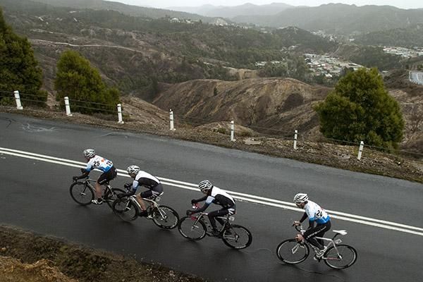 The Black Peloton team from New Zealand climb their way out of Queenstown.