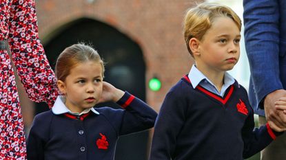 Britain's Princess Charlotte of Cambridge, with her brother, Britain's Prince George of Cambridge, arrives for her first day of school at Thomas's Battersea in London on September 5, 2019.