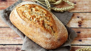 Loaf of bread on bread board