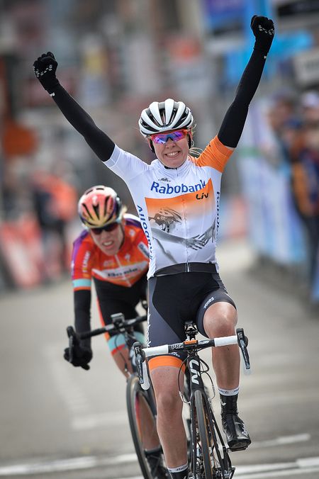 Van der Breggen celebrates her win ahead of Van Dijk.