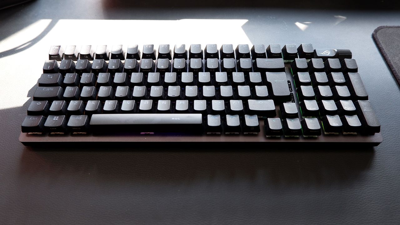 Asus ROG Strix Scope II 96 Wireless gaming keyboard on a desk.