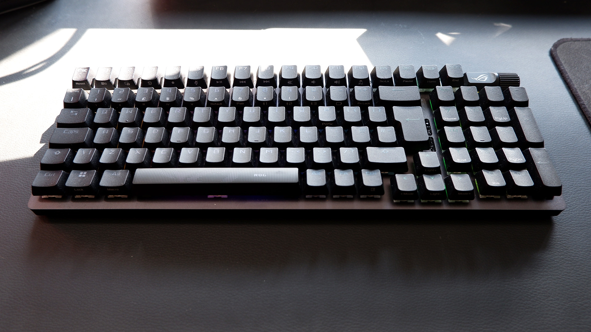 Asus ROG Strix Scope II 96 Wireless gaming keyboard on a desk.
