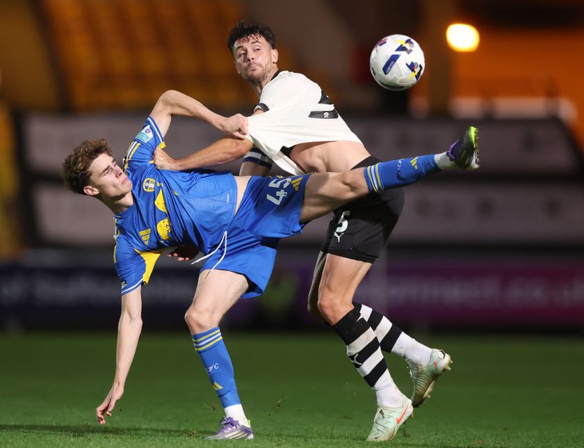 BURSLEM, ENGLAND - SEPTEMBER 02: Harry Gray of Leeds United U21 and Connor Hall of Port Vale battle for the ball during Vertu Trophy match between Port Vale and Leeds United U21 at Vale Park on September 02, 2025 in Burslem, England. (Photo by Carl Recine/Getty Images)